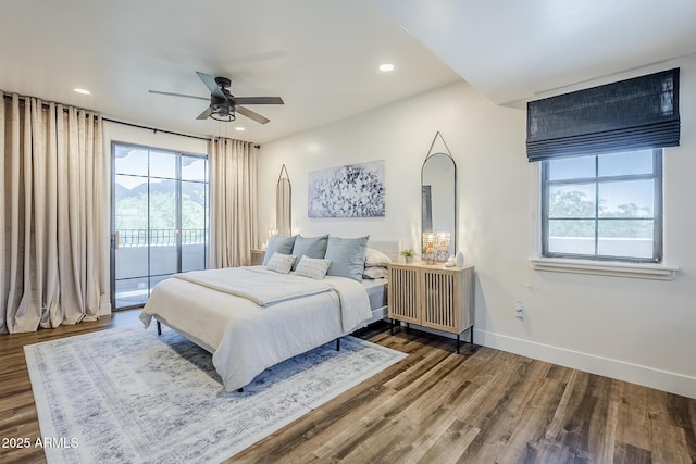 bedroom with baseboards, access to outside, recessed lighting, and wood finished floors