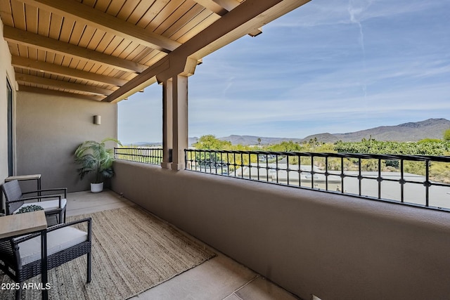 balcony featuring a mountain view