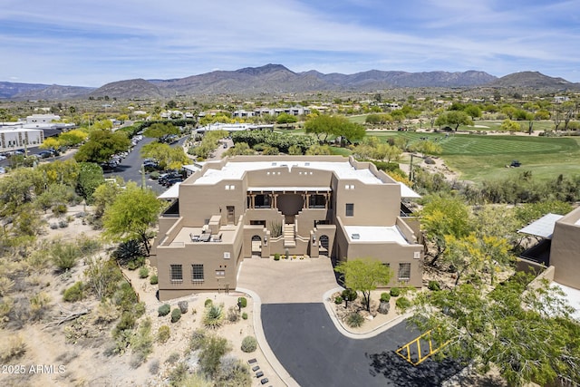 birds eye view of property featuring a mountain view