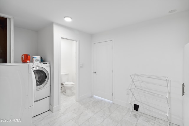 3758 E Sunnyside Dr, Phoenix, AZ 85028 - laundry room featuring baseboards, marble finish floor, separate washer and dryer, and laundry area