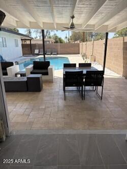 3758 E Sunnyside Dr, Phoenix, AZ 85028 - view of swimming pool featuring a patio area, a fenced backyard, a fenced in pool, and outdoor dining area