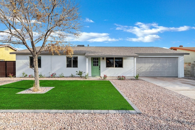 single story home featuring a front yard and a garage