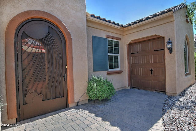 property entrance with a garage