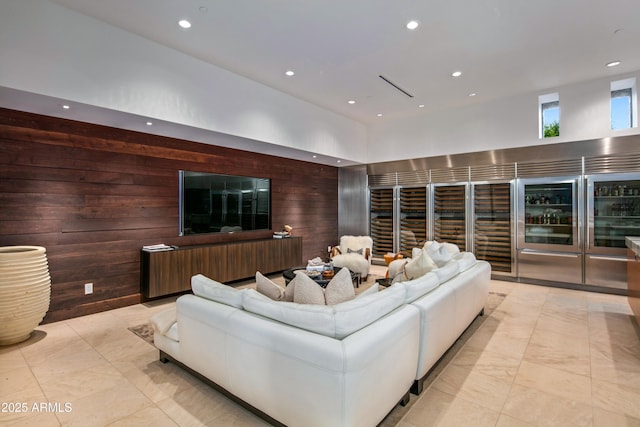 living room featuring wood walls