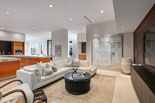 living room with light tile patterned floors