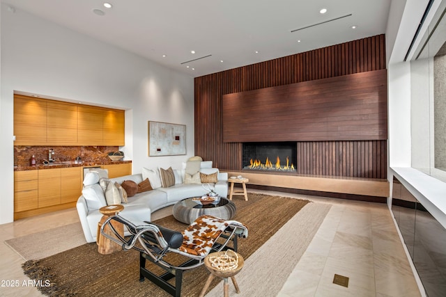 living room with a high ceiling