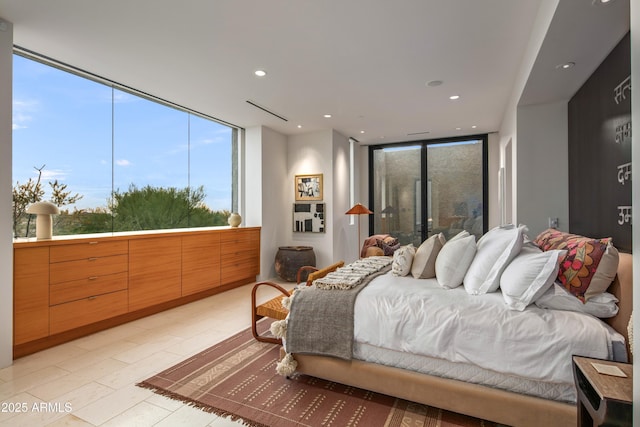 bedroom with a wall of windows