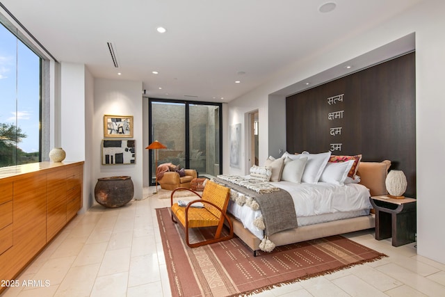 bedroom featuring expansive windows