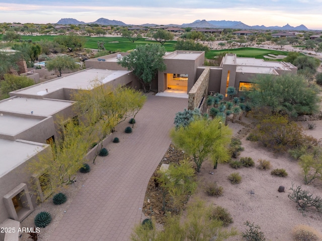 birds eye view of property featuring a mountain view