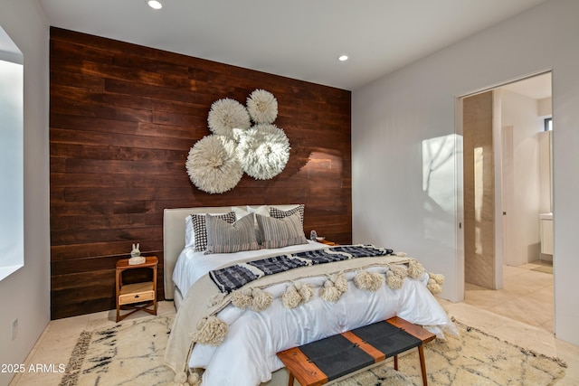 bedroom with wood walls