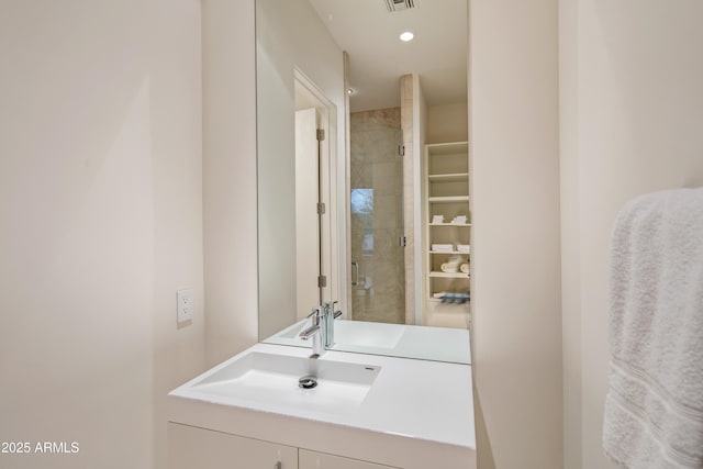 bathroom featuring vanity and walk in shower