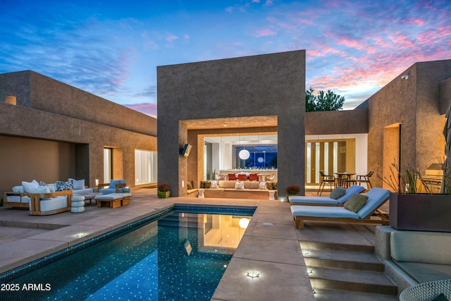 view of pool with an outdoor hangout area and a patio