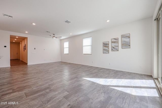 spare room with ceiling fan