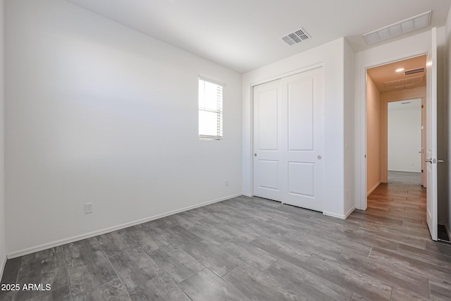 unfurnished bedroom featuring a closet