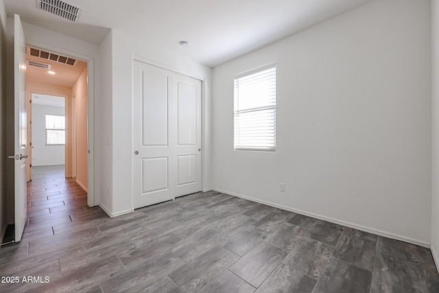 unfurnished bedroom featuring a closet