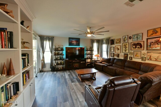3062 E Cullumber St, Gilbert, AZ 85234 - living area with a ceiling fan, wood finished floors, visible vents, and a healthy amount of sunlight