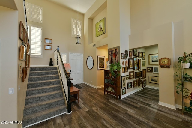 3062 E Cullumber St, Gilbert, AZ 85234 - entryway featuring visible vents, baseboards, dark wood finished floors, a towering ceiling, and stairs