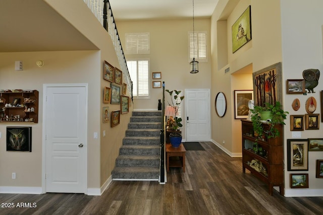 3062 E Cullumber St, Gilbert, AZ 85234 - entrance foyer featuring a towering ceiling, baseboards, stairway, and dark wood-type flooring
