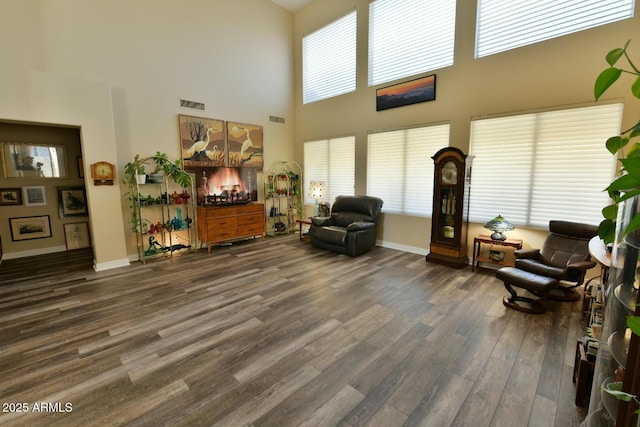 3062 E Cullumber St, Gilbert, AZ 85234 - interior space with dark wood-style floors, visible vents, a towering ceiling, and baseboards