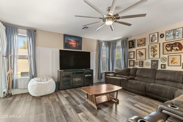 3062 E Cullumber St, Gilbert, AZ 85234 - living area with ceiling fan, wood finished floors, visible vents, and a healthy amount of sunlight