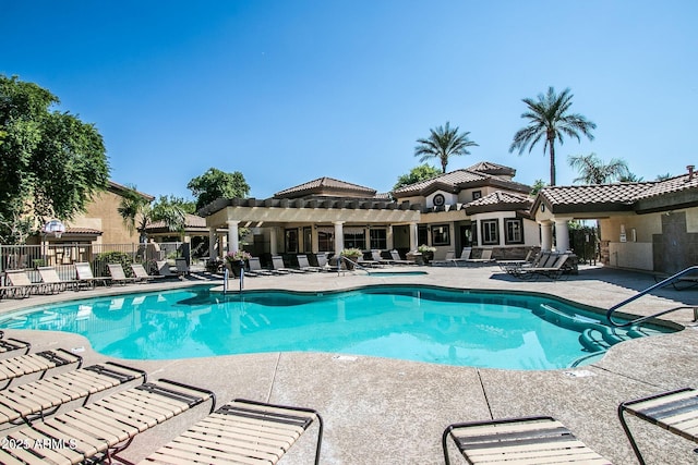 view of pool with a pergola and a patio area