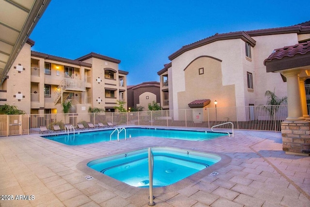 view of pool featuring a hot tub