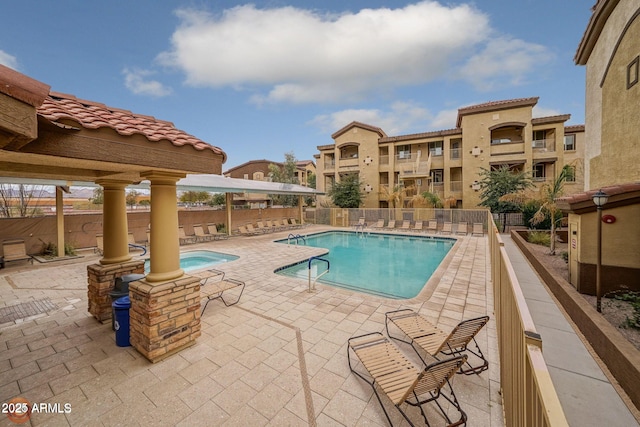 view of swimming pool with a patio