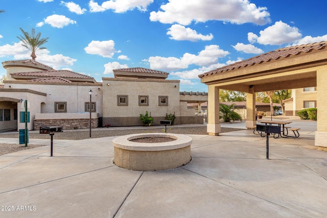 view of patio / terrace featuring a fire pit