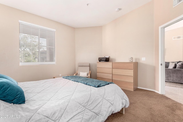 bedroom with light carpet