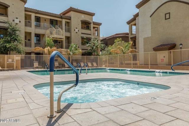 view of pool with pool water feature