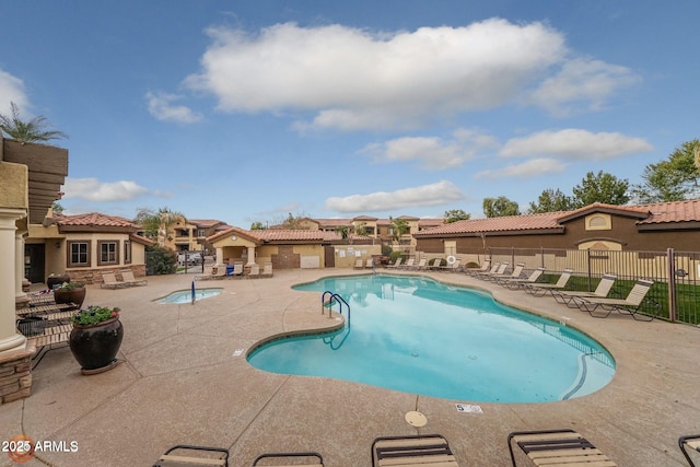 view of swimming pool featuring a patio area