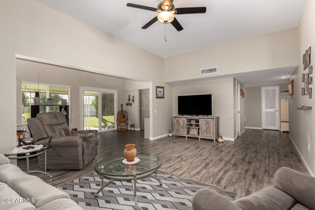 living room featuring wood-type flooring and ceiling fan