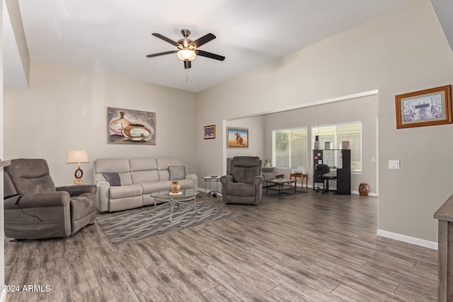 living room with hardwood / wood-style flooring and ceiling fan