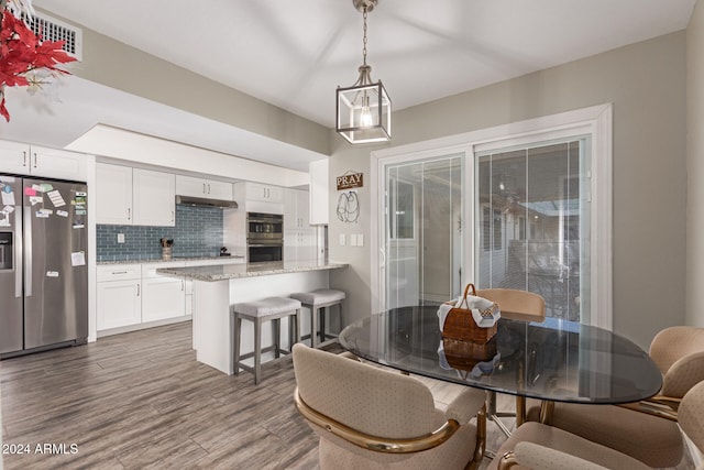 dining area featuring hardwood / wood-style flooring