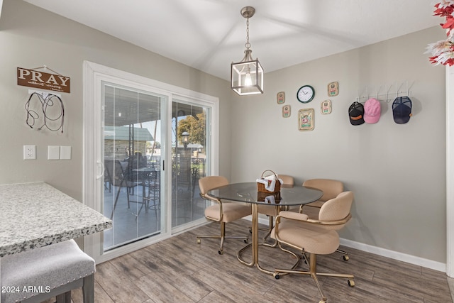 dining space featuring hardwood / wood-style flooring