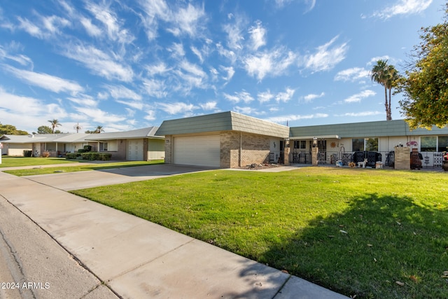 ranch-style home with a front yard and a garage