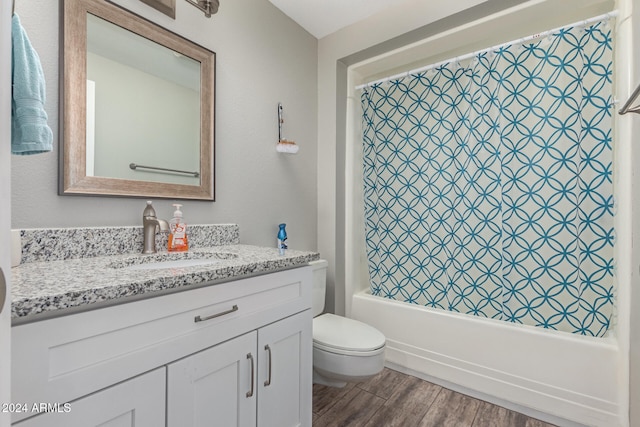 full bathroom with vanity, hardwood / wood-style flooring, toilet, and shower / tub combo with curtain