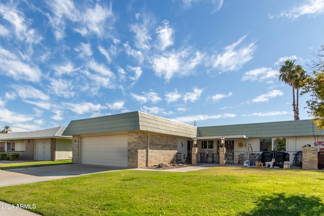 ranch-style house with a garage and a front yard