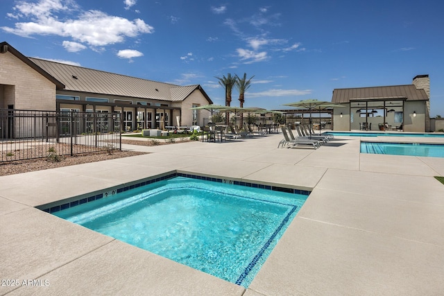 view of swimming pool with a patio area