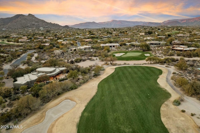 aerial view at dusk featuring a mountain view