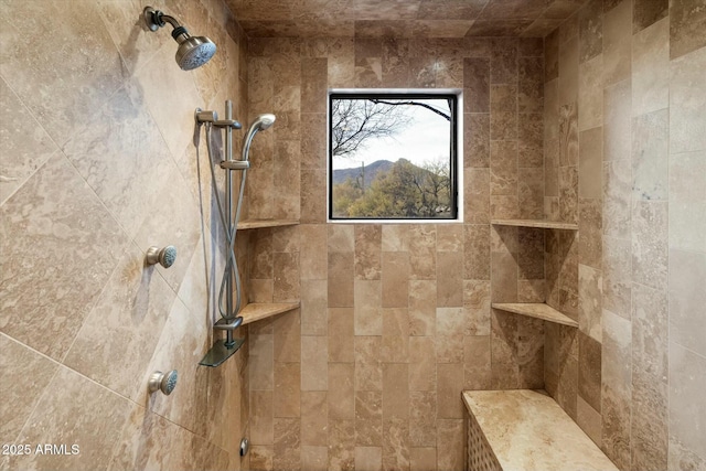 bathroom with tiled shower