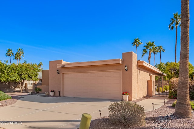 southwest-style home with a garage