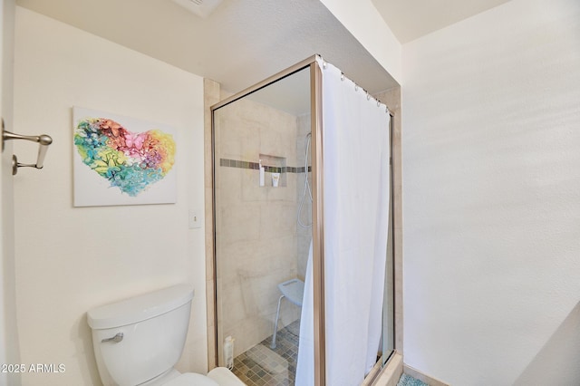 full bath with toilet and a shower stall