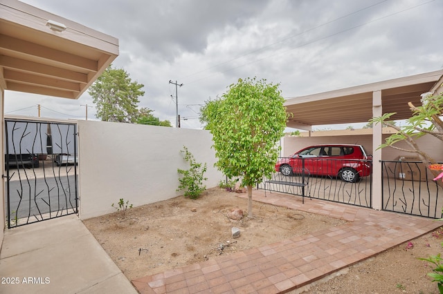 view of patio / terrace featuring fence and a gate
