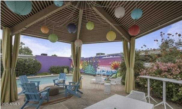 view of patio featuring a fenced in pool