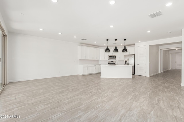 4051 S Galaxy Ln, Mesa, AZ 85212 - unfurnished living room with recessed lighting and baseboards