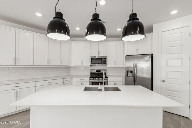 4051 S Galaxy Ln, Mesa, AZ 85212 - kitchen featuring appliances with stainless steel finishes, white cabinetry, light wood-type flooring, and recessed lighting
