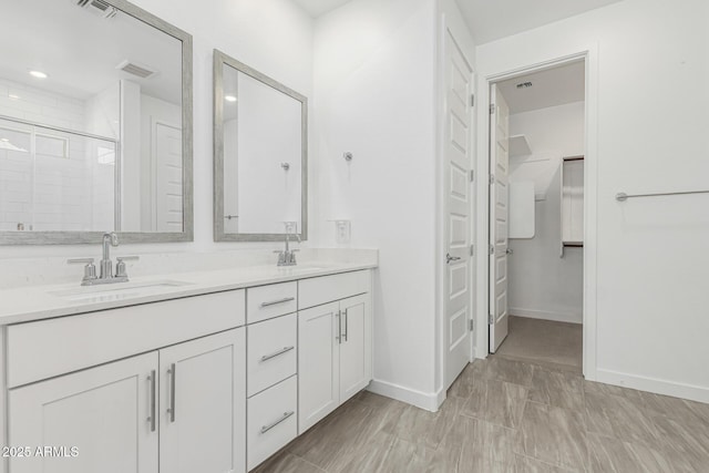 4051 S Galaxy Ln, Mesa, AZ 85212 - full bath featuring double vanity, a shower stall, baseboards, and a closet