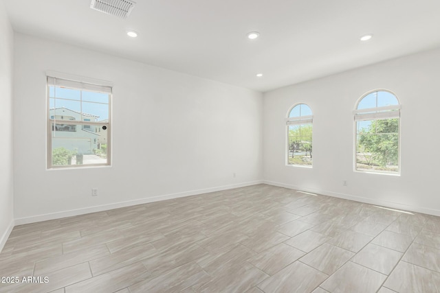 4051 S Galaxy Ln, Mesa, AZ 85212 - empty room with plenty of natural light, recessed lighting, and baseboards