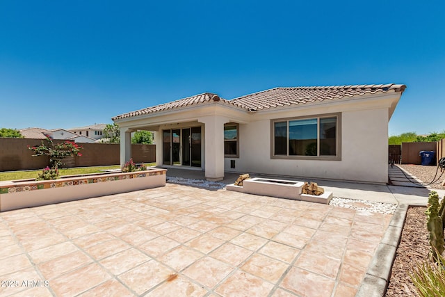 4051 S Galaxy Ln, Mesa, AZ 85212 - rear view of house featuring a tiled roof, a fire pit, stucco siding, and a patio